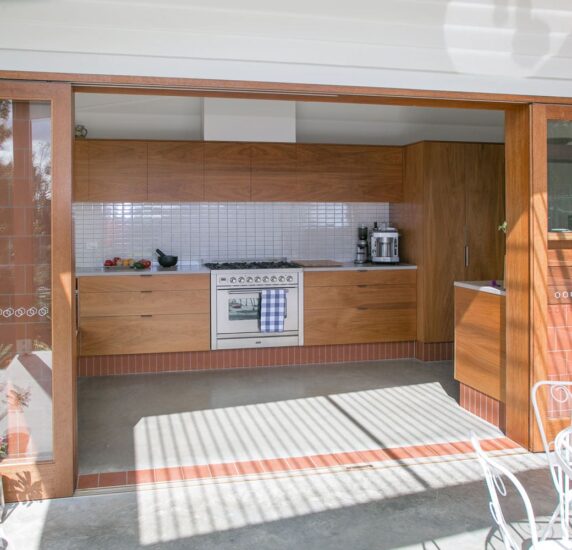 light blonde colour timber sliding doors kitchen living outdoor dining deck
