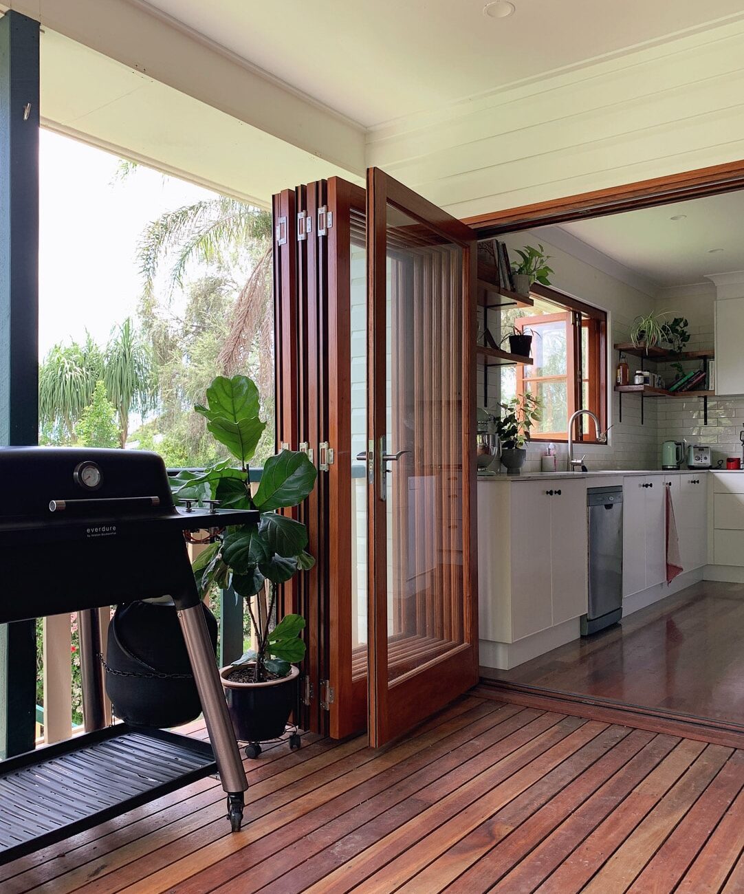 back deck with high quality custom timber framed glass bi-fold doors and flooring