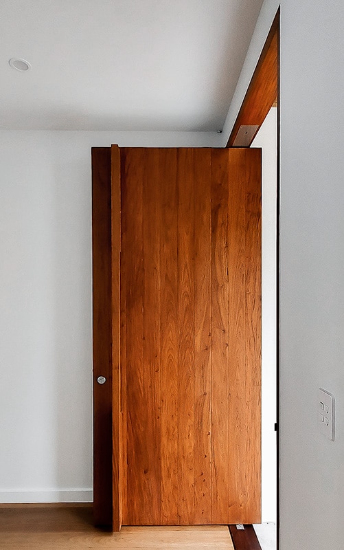 large timber door with top to bottom handle